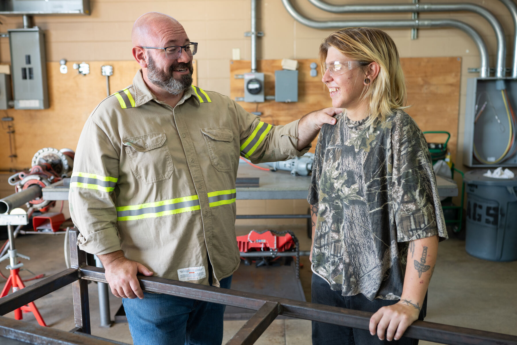 Brian Nathan meeting with workers at a training facility
