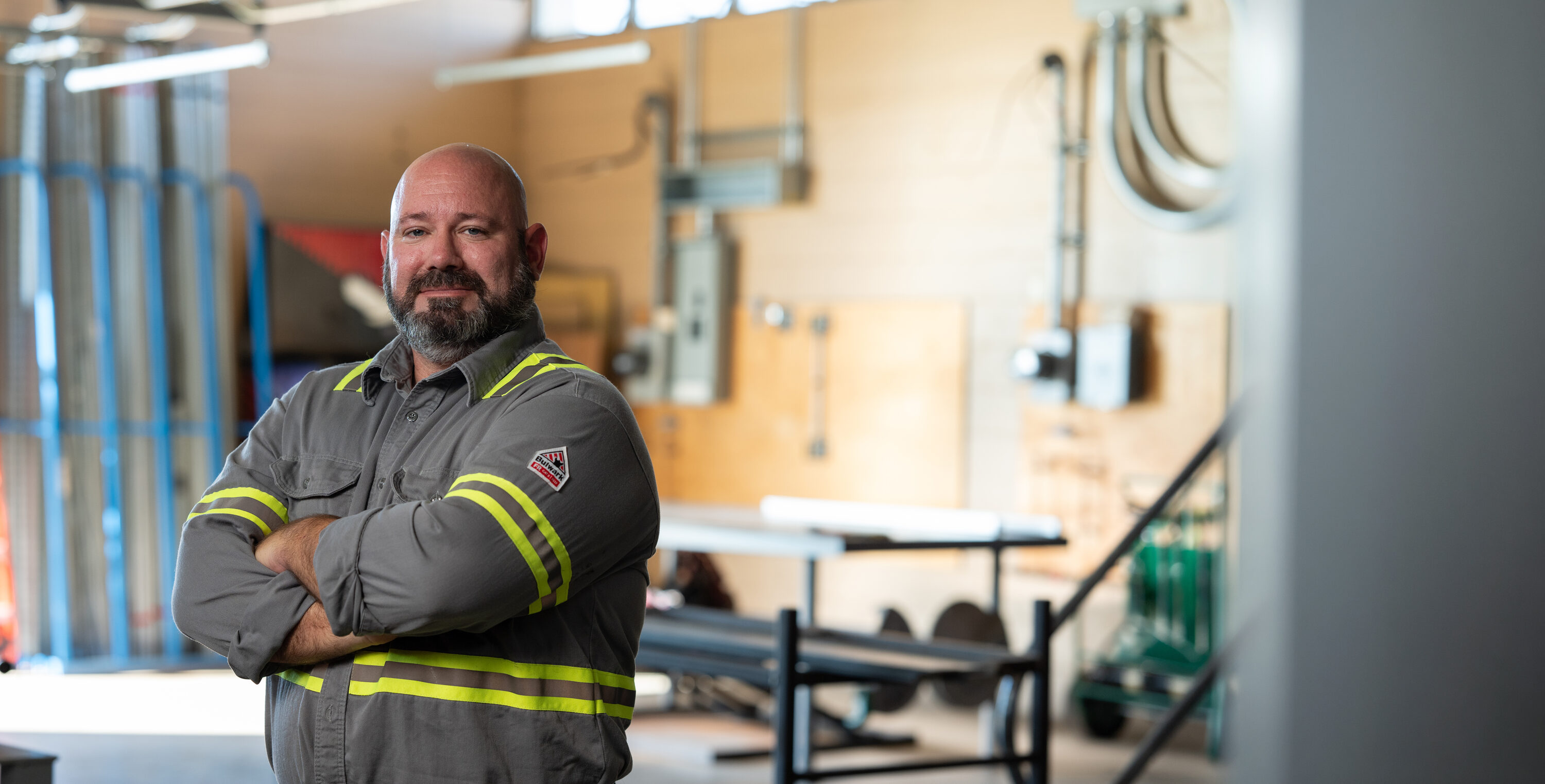 Brian Nathan in his IBEW work uniform at an electrical training facility